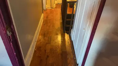 a hallway with a wooden floor in a house at 2218NColoradoC in Philadelphia