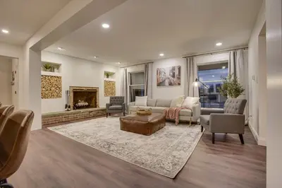 a living room with a couch and a fireplace at Zook Manor with Hot tub Firepit and Game Room in Atglen