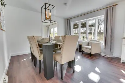 a dining room with a table and chairs at Zook Manor with Hot tub Firepit and Game Room in Atglen