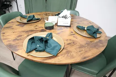 a wooden table with plates and hats on it at Modern Minimalist Lux Paradise in Newark
