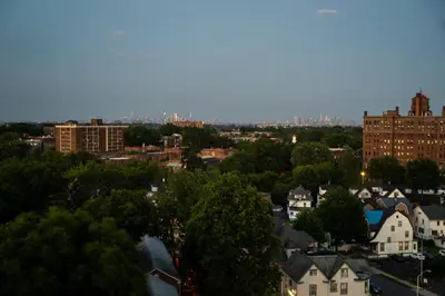 a view of a city with buildings and trees at Luxury Lookout with NYC view, 2BR plus Free Parking, Sleeps 8, 20 Percent Off in East Orange
