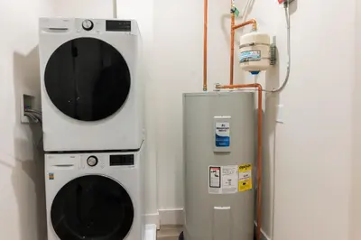 a washing machine and a dryer in a room at Luxury Lookout with NYC view, 2BR plus Free Parking, Sleeps 8, 20 Percent Off in East Orange