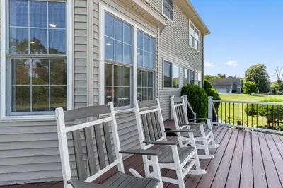 three chairs sitting on a porch of a house at Malkita Terra -Earthly Elegance in Woodbury