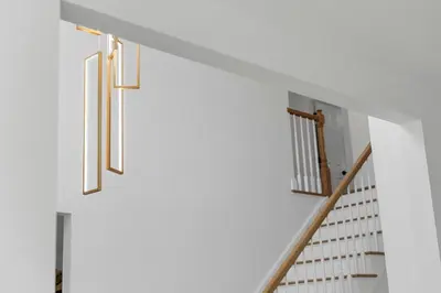a staircase in a house with white walls at Malkita Terra -Earthly Elegance in Woodbury