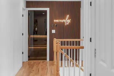 a door to a store with a sign on the wall at Malkita Terra -Earthly Elegance in Woodbury