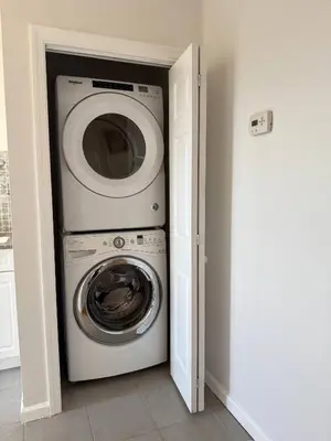 a washer and dryer in a small room at Sunset Slopes in Jersey City