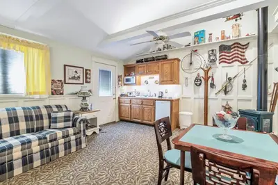 a living room with a couch and a table at Quiet Getaway with Queen Bed & Wi-Fi in Clarks Summit