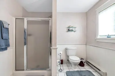 a bathroom with a shower and a toilet at Quiet Getaway with Queen Bed & Wi-Fi in Clarks Summit