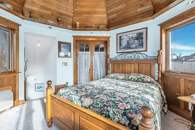 a bedroom with a bed and a wooden ceiling at Clarks Summit Gem w/ Private Yard & Parking in Clarks Summit