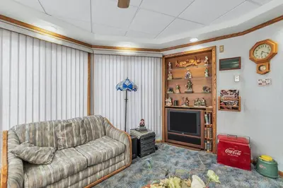 a living room with a couch and a tv at Clarks Summit Gem w/ Private Yard & Parking in Clarks Summit