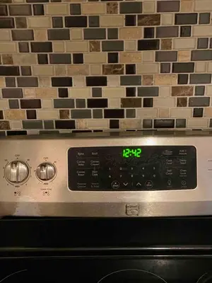 a clock on top of an oven with a brick wall at VIP Pocono Escape Water Park,Casino,All Inclusive in East Stroudsburg