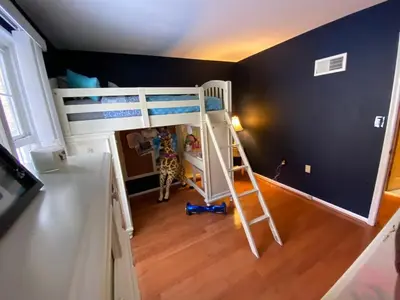 a room with a bunk bed and a ladder at VIP Pocono Escape Water Park,Casino,All Inclusive in East Stroudsburg