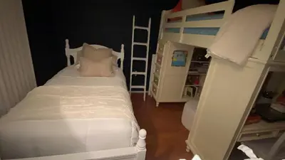 a bedroom with two bunk beds and a ladder at VIP Pocono Escape Water Park,Casino,All Inclusive in East Stroudsburg