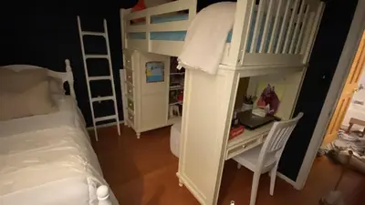 a small bedroom with a bunk bed and a desk at VIP Pocono Escape Water Park,Casino,All Inclusive in East Stroudsburg