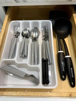 a plastic tray with utensils in a drawer at A Cozy Corner with kitchen and parking in Drexel Hill