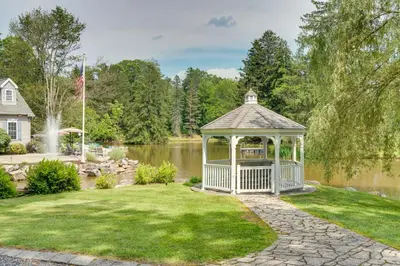 a gazebo in a yard next to a lake at Fish and Hike Lakeside Poconos Retreat, Unit 4 in Bangor
