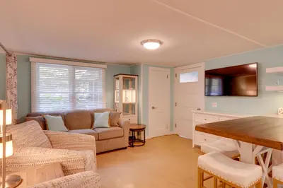 a living room with a couch and a table at Fish and Hike Lakeside Poconos Retreat, Unit 4 in Bangor