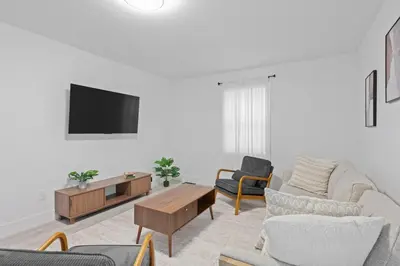 a living room with a couch and a tv at 15m to NY Cozy Relaxing Home in Hackensack