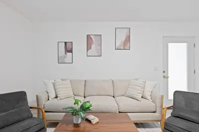 a living room with a couch and a table at 15m to NY Cozy Relaxing Home in Hackensack