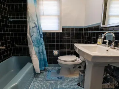 a bathroom with a toilet and a sink at New 3 Bed & 1 Bed Apt Lake Park Station EWR Airport Path Train Subway Bus Hospital Rahway NJ Manhattan NYC in Rahway