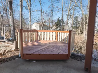 a wooden bench sitting on a porch with trees at New 3 Bed & 1 Bed Apt Lake Park Station EWR Airport Path Train Subway Bus Hospital Rahway NJ Manhattan NYC in Rahway