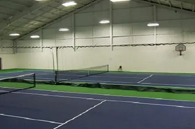 a tennis court with a net on a court at Rustic Mountain Escape Waterpark, Ski & Views! in Tannersville
