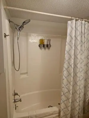 a bathroom with a shower with a shower curtain at Rustic Mountain Escape Waterpark, Ski & Views! in Tannersville