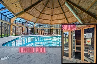a large swimming pool in a building with a tent at Rustic Mountain Escape Waterpark, Ski & Views! in Tannersville
