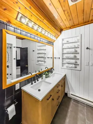 a bathroom with a sink and a mirror at Italy Inspired Lakeview Chalet with Hot Tub in Lake Harmony
