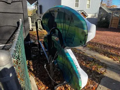 a small airplane is parked next to a fence at Italy Inspired Lakeview Chalet with Hot Tub in Lake Harmony