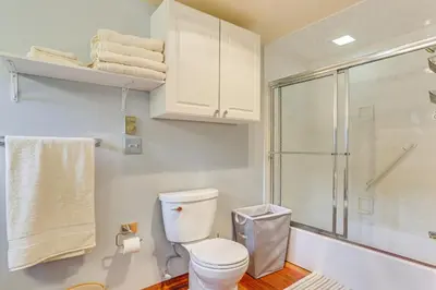 a bathroom with a toilet and a shower at 13 Mi to Ski Big Bear Updated Getaway with Deck in Shohola