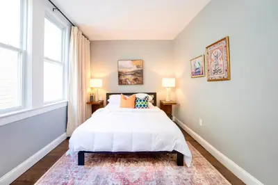 a bedroom with a bed and a window at The Hillside | Full House | Parking | Near EWR-NYC in Newark