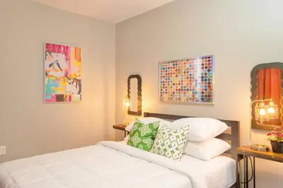 a bedroom with a white bed with pillows on it at The Hillside | Full House | Parking | Near EWR-NYC in Newark