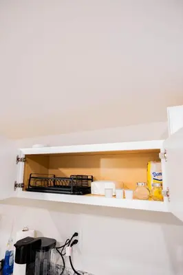 a shelf in a kitchen with food on it at Joynest Loft - Private Entry & Bath in Newark