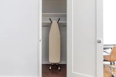 a door leading into a room with a dresser at Blueground Midtown East doorman nr MoMA NYC-1786 in New York