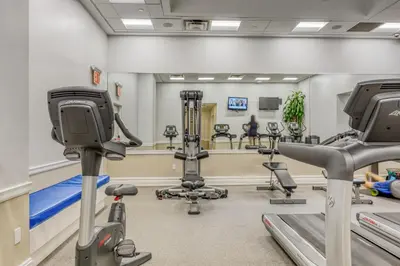 a gym with treadmills and exercise equipment in a room at Midtown Studio w Doorman Gym nr MSG NYC-143 in New York