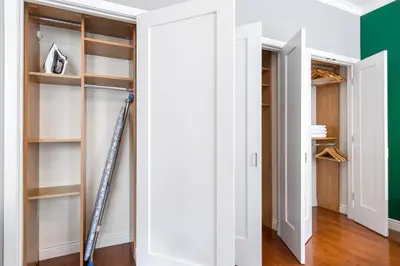 a ladder in a closet with shelves at Midtown Studio w Doorman Gym nr MSG NYC-143 in New York