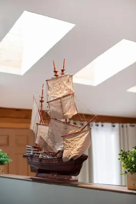 a model of a pirate ship hanging from a ceiling at 5 min to Lake Chic Cozy Hot Tub in Sparta