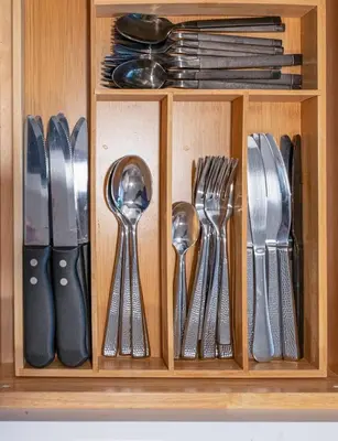 a drawer with silver utensils in it at Cozy Home, 17 min from NYC, 2 Parking Spaces in Ridgefield Park
