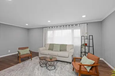 a living room with a white couch and chairs at Cozy Home, 17 min from NYC, 2 Parking Spaces in Ridgefield Park