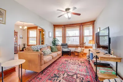 a living room with a couch and a flat screen tv at 6 Mi to Montage Mtn Resort! Family Home with Yard in Scranton