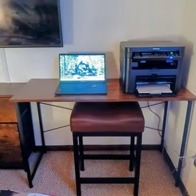a desk with a laptop computer and a printer at Hideout Pocono Chalet in Lake Ariel