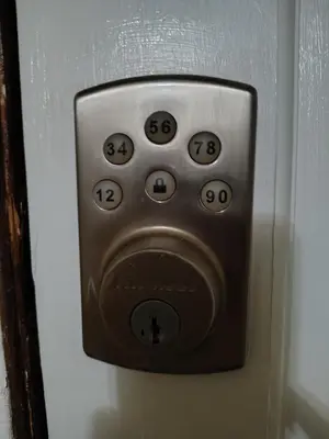 a close up of a remote control on a wall at Cozy apartment in Brooklyn