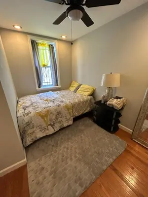 a bedroom with a bed and a window at Theres No Place Like Home in Philadelphia
