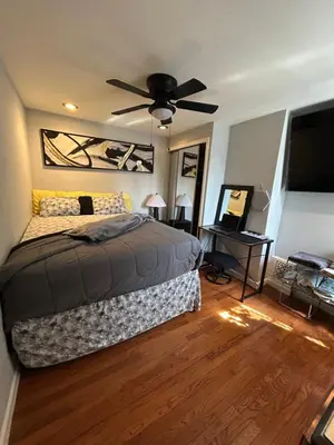 a bedroom with a bed and a ceiling fan at Theres No Place Like Home in Philadelphia