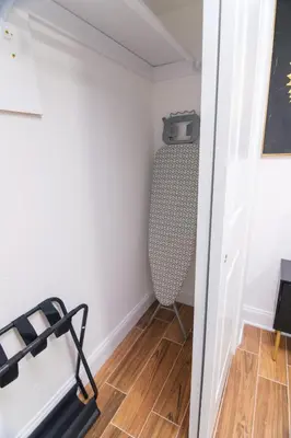 a small room with a treadmill and a chair at BrightOAK Eloire-Private in Newark