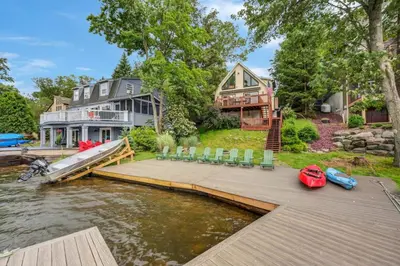 a home on the water with a dock at beautiful lakefront lodge in Lake Harmony