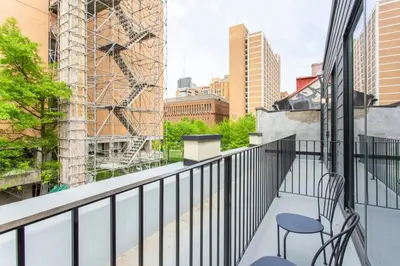 a balcony with chairs and a view of the city at Inventors Loft Luxury Upscale Quiet Two Bedroom in Philadelphia