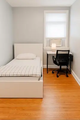 a bedroom with a bed and a desk and a chair at Cozy Drexel Hill Retreat - Perfect for Families in Drexel Hill