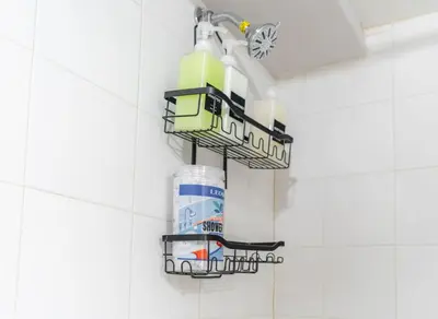 a bathroom with a bottle of bleach hanging on a wall at Cozy Private Room in Shared Space NYC Light Rail in Bayonne